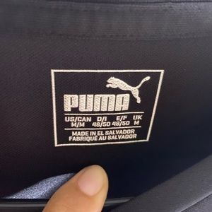 Puma black with red strip shoulders